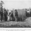 A practical field lesson in Agriculture being given to Negro farmers in Alabama by the Farmers' Institute of Tuskegee.