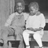 African American children sitting on the stairs