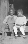 African American children sitting on the stairs