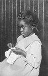 An African American girl; Caroline's play