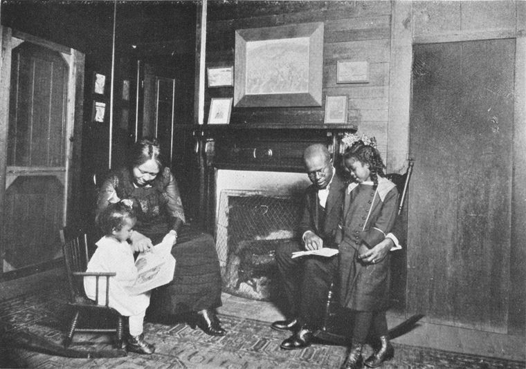 An African American family; Reading books.