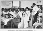 Sewing lesson in a Gloucester County school, Va.