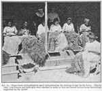 Negro home demonstration agent demonstrating the making of rugs for the home; During 1924, 7,688 women and 8,656 girls were enrolled to make or buy and install certain house furnishings suggested by the agents.