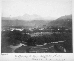 View of Public Square, Fort-de-France. Head of the statue of Josephine just visible over the avenues of tamarind trees. "Montant Peelee" [Mount Pelée] in the distance, 4000 feet high.