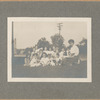 Highbridge, Exterior, librarian and children on grass looking at camera