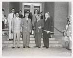 Dedication, Ribbon Cutting: (front row left-right) Raymond A. Harris, Librarian; Ralp A. Beals, Director, The New York Public Library; Honorable Frederick H. Zurmuhlen, Commissioner of Public Works; Mr. Morris Hadley, President, the New York Public Library. (rear row, at left) Peter B. Putnam, Author and Assistant Instructor, princeton University; (3rd from right) Mr. John M. Cory, Chief, Circulation Department, the New York Public Library