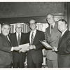 State senator Roy M. Goodman (center) and Assemblyman Mark Alan Siegel (right) receive resolutions of appreciation for their leadership efforts in securing funding for a new Library for the Blind and Physically Handicapped.  Presenting the resolutions at the annual meeting of the Board of Trustees are Vartan Gregorian, Senator Abraham A. Ribicoff, and Chairman Andrew Heiskell