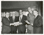 State senator Roy M. Goodman (center) and Assemblyman Mark Alan Siegel (right) receive resolutions of appreciation for their leadership efforts in securing funding for a new Library for the Blind and Physically Handicapped.  Presenting the resolutions at the annual meeting of the Board of Trustees are Vartan Gregorian, Senator Abraham A. Ribicoff, and Chairman Andrew Heiskell