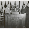 Mosholu, (left) Zurmuhlen, (middle, speaker) Deputy Mayor Epstein] E.G. Freehafer [second from left, next to unidentified man]