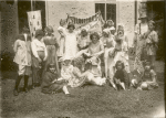 New Dorp, Seated librarian with costumed children at story hour