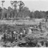 New Hanover county prisoners preparing road materials. No stripes or chains are used.