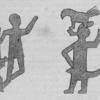 Two figures of men representing two war fetiches, the one armed with a musket, and the other with a broad sword