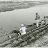 Migratory workers fishing to eat, Belle Glade, Florida, January 1939.