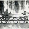 Wartime vacations; Sunday cyclists watching sailboats at Haines Point; Washington, D.C.