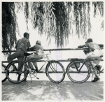 Wartime vacations; Sunday cyclists watching sailboats at Haines Point; Washington, D.C.