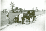 Repairing tire on road near Knowlton Plantation, Perthshire, Mississippi Delta, Mississippi, October 1939.