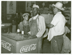 Mexican and negro cotton pickers inside plantation store, Knowlton Plantation, Perthshire, Miss. Delta. This transient labor is contracted for and brought in trucks from Texas each season. October 1939.