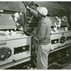 Removing the seed from cotton gin on Hopson Plantation; Clarksdale, Mississippi, Nov. 1939.
