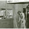 Chitterling, fish and sugar cane on street in Negro Section, Clarksdale, Mississippi Delta; On a Saturday afternoon, November 1939.
