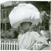 Woman carrying bundle on head, Natchez, Mississippi, August 1940.