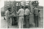 Migrants getting truck ready to leave Belcross, N.C. for Onley, Va., July 1940.