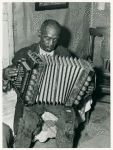 John Dyson, FSA (Farm Security Administration) borrower, playing the accordion; He was born into slavery over eighty years ago, St. Mary's County, Maryland, September 1940.