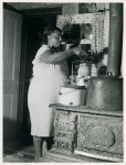 Mrs. Harry Handy canning corn with aid of pressure cooker. Saint Mary's County, Maryland, September 1940.