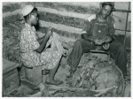 Compton, Negro sharecropper and his wife stripping and grading tobacco. He has a Negro landlord who lives in Mebane, part of a very prosperous Negro settlement, region of North Carolina. September 1939.