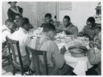 The Negro tenants and neighbors eating dinner after the white men have finished, on day of corn-shucking at Mrs. Fred  Wilkins' home. Tallyho, Stem, Granville County, No. Car., Nov 1939.