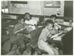 Negro school children studying near Southeast Missouri Farms, August 1938.