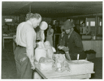 Southeast Missouri Farms--making a purchase at cooperative store, La Forge, Missouri, May 1938.