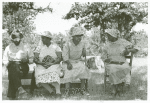 Negroes waiting outside a rural church while other members of their families are attending a church business meeting, McIntosh County, Oklahoma.