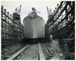 Bow-side view of Liberty ship SS Frederick Douglass sliding down the ways on the day of its launching