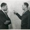 Major Steve G. Davis, General Staff Corps, points to areas that will be visited by Mr. Marcus to areas that will be visited by Mr. Marcus H. Ray [left], Civilian Aide to Secretary of War, on his tour of Army installations in the European and Mediterranean Theaters where Negro troops are stationed