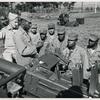 African American soldiers learning how to operate antiaircraft guns with the help of their instructor