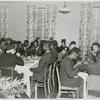 African American wounded soldiers, sailors, marines and Coast Guardsmen sitting at tables and enjoying their Thanksgiving dinner, at Lucy D. Slowe Hall, Washington, D. C.