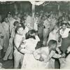 African American soldiers and their peer civilians dancing in the hall of a recreational facility