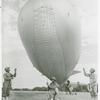 African American soldiers holding a barrage balloon to demonstrate its operations in the Third War Loan Drive in Washington, D. C.