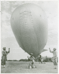 African American soldiers holding a barrage balloon to demonstrate its operations in the Third War Loan Drive in Washington, D. C.