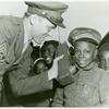 James Edward Sommerville watches Sgt. Arthur Dertrom demonstrate the Army's "handie-talkie" during the stopover of the WAC [Women's Army Corps]- War Bond Caravan in Cartersville, Ga., in the Fourth war Loan Drive