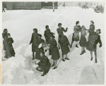African American members of the Women's Army Corps standing in the snow and throwing snowballs at each other, Camp Shanks, New York