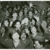 A crowd of African American Women's Army Corps members waving at the camera, Staten Island Terminal, New York Port of Embarkation