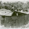 U.S. Navy African American Seabees covering a steel tank, South Pacific bases