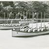 Three crews of African American sailors sitting in their cutters at the end of a boat drill session, U.S. Naval Training Station