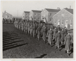 Members of an all-African American company walking in rows during an infantry drill at the First Women's Army Auxiliary Corps Training Center