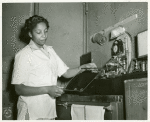 African American Private Hannah Wills developing an x-ray film in the x-ray laboratory at Post Hospital, Camp Breckinridge