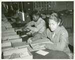 Members of the Women's Army Corps identifying incorrectly addressed mail for soldiers, Post Locator Department, Camp Breckinridge