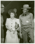 Elaine Mulzac, an African American woman, daughter of SS Booker T. Washington skipper, talking to two shipyard employees