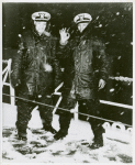 Two African American Navy officers, [left to right] Ensign J. J. Jenkins and Clarence Samuels, aboard a cutter on the North Atlantic patrol