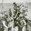 African American seamen delivering shells and loading the anti-aircraft gun aboard a vessel on the Atlantic patrol